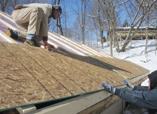 New beveled 2x6 subfascia "extenders" accommodated the 3 1/2 inches of added roof thickness.