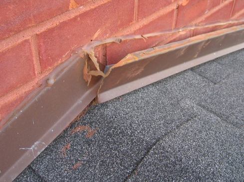 The saw-cut flashing I typically come across is held in place with sealant and the occasional nail wedged between the metal and the brick. The sloped flashing shown here was only cut in about 1/2 inch and has simply fallen out of the wall on its own. The continuous bead of caulk used to keep the flashing in place is often installed under a misguided attempt to prevent water from “getting in.” The irony is they’ve sealed the location where water should be getting out.