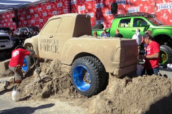 I’ve seen the 
Sand Guys do their thing at multiple tradeshows and it’s always something awesome. This time they sculpted a truck at the American Force (truck wheels and accessories) booth in one of the parking lots. If spending the day outdoors listening to music and making sand art is a job, I want to know why my high school guidance counselor didn’t tell me about it.