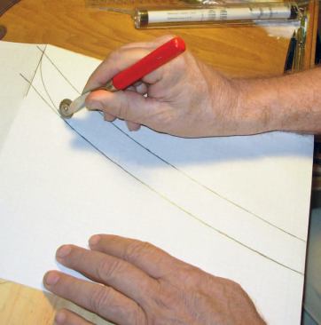 Make the Wood Router Template: It’s important to do this step carefully: The smoother the template, the better the fit. First I use a spiked tracing wheel (typically used to transfer patterns to fabric) to transfer the drawing from the paper to my template material — a scrap piece of pine in this case.