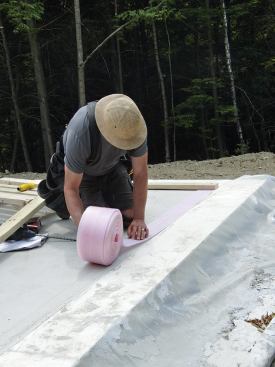 To protect the poly air barrier, the crew rolled out sill seal.
