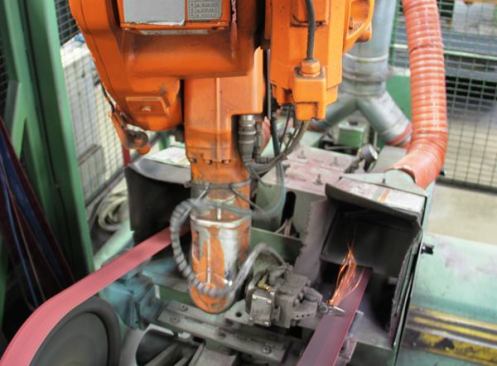 Here an industrial robot grabs an assembled pair of plier jaws and grinds them to finished shape. The photo does not do it justice; 
click here to see a video of the robot in action.