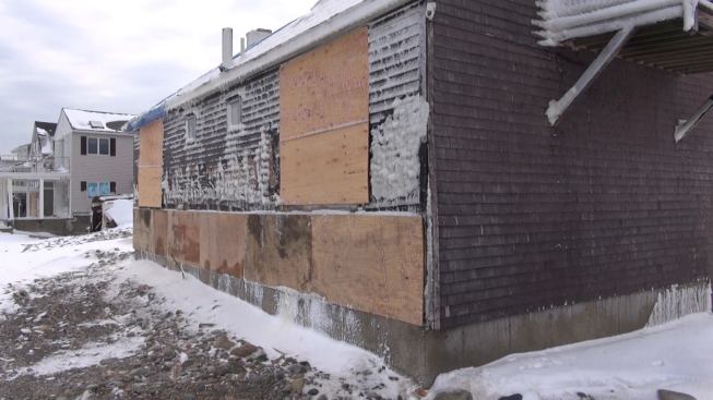 The back of the house near the failed seawall, where wind-driven water did major damage.