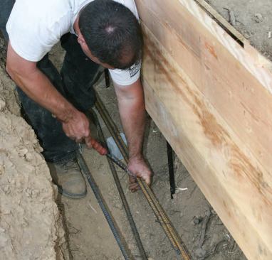 To speed tying and ease wrist strain, the crew used inexpensive manual twist tools that wind the ends of the wire when their handle is pulled.