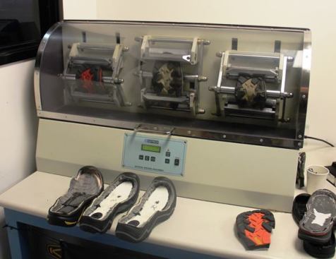 Just off the floor of the factory is a testing lab used to insure that each batch of boots is up to spec. This flex test machine is used to test the durability of the outsole and shank. Every two hours a boot is pulled from the line, has the bottom cut off of it, and a small hole made in the outsole. The piece is then subjected to 30,000 flexes (an industry standard = to 40 miles of walking in extreme conditions) to see if the hole gets bigger. 
Click here for video.