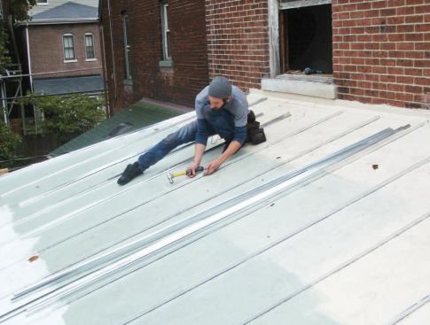 To match the roof of the main house, faux standing seams were added to the plywood roof sheathing on the addition.