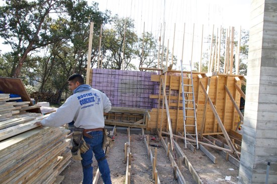 On this project, freestanding board-form wall sections required lots of staked kickers and wales to hold the formwork secure.