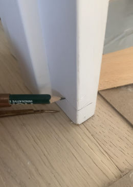 With the jamb in the RO and the head checked for level, the author sets scribes to the mark he initially made on the hinge side and scribes both legs.
