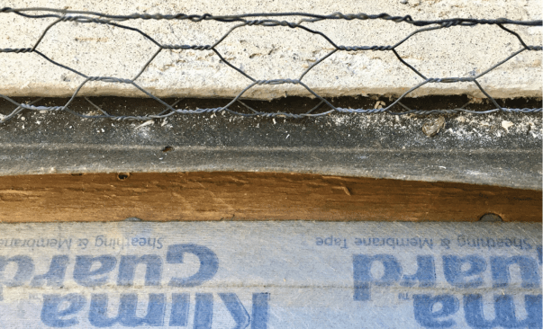 If the plywood is flush or overhangs the concrete, apply tape over the joint. This will stop any air from moving under the bottom plate, which constitutes the lion’s share of stucco leaks.