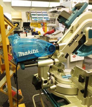I had to go to Germany to see the Dust Extracting Box (194175-6) on this Makita miter saw—and yet it has been available in the U.S. for at least a couple of years. A replacement for a dust collection bag, it uses cyclonic action (think Dyson vacuum) to collect dust in primary and secondary chambers. Air exits through the top and is said to be free of dust. The unit can be removed and emptied the same as a dust bag.