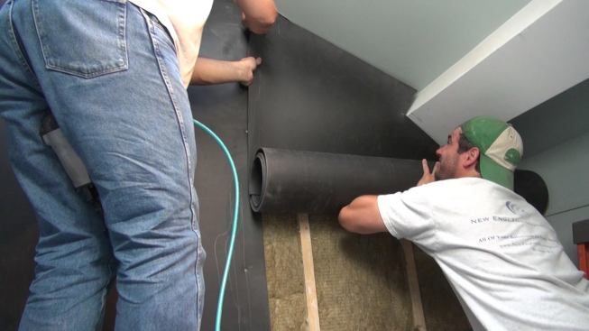 Even a cut-down and trimmed piece of the heavy sheet vinyl takes effort to set in place.
