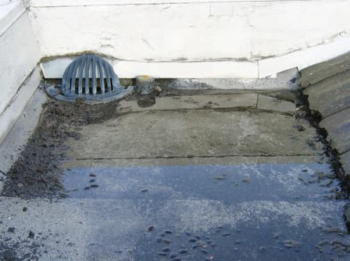 On the roof, we found that ponding was occurring because an overflow drain at the parapet wall was improperly installed.