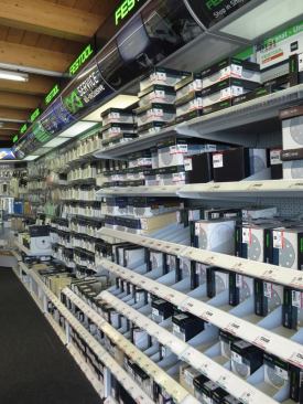 The back wall of the main room contains an impressive assortment of Festool sanding and polishing supplies—including more kinds of their sandpaper than I have seen outside of a catalog.