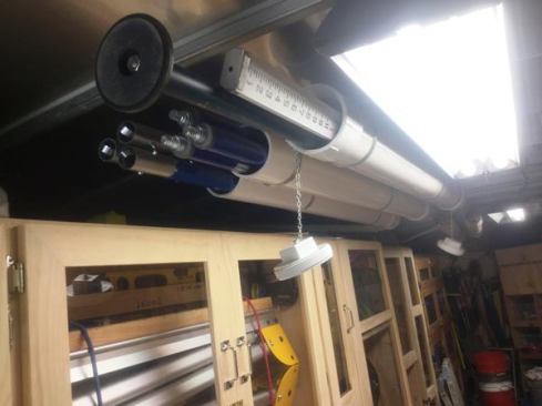 Pipes on the ceiling are used to store a surveyor’s rod and sections of handle for use with concrete floats.