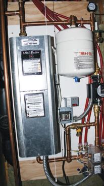The closet contains a 50-gallon hot-water tank, a small electric boiler for the bathroom's hydronic heating system, and the remote shower valve.