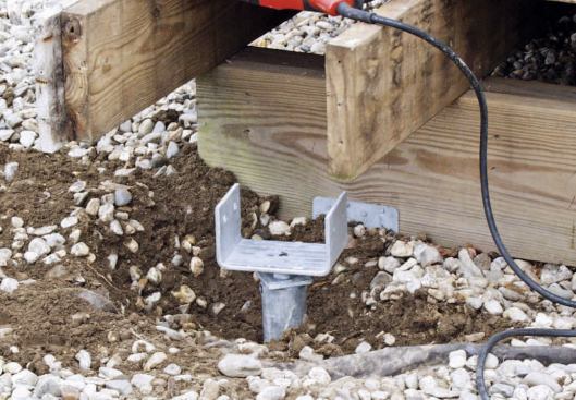 The piers are capped with a metal post bracket.