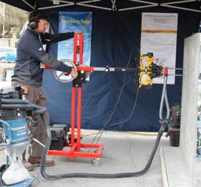 The ErgoMek Drill Boss is designed for the contractor who needs to drill a LOT of holes. Instead of holding the rotary hammer by hand, you mount it in the gizmo and then turn the crank. 
Click here for more info and to see it in action.