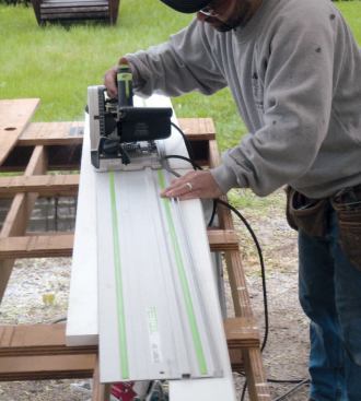 Assembling the Cap: To add a tapered vertical skirt to match the pressure-treated wood frame, I cut tapered sides with my track saw.