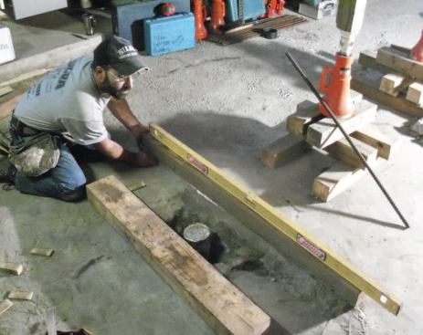 Once the footings have been laid out I can set up the temporary supports. I spend some time making sure the cribbing is dead level.