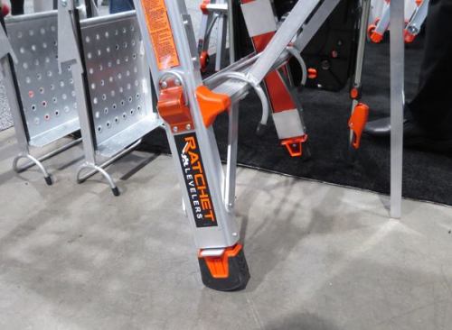 This Little Giant 
Extreme Series ladder has a brand new feature, adjustable ratcheting leg levelers. To extend the levelers, place your foot on the metal piece that sticks out from between the foot and the leg and then lift or tilt the ladder. The level will ratchet out up to 9 1/2”. Retracting the leg is a matter of pulling up on the D-ring across from the bottom rung. It’s a clever, mostly hands-free, system.