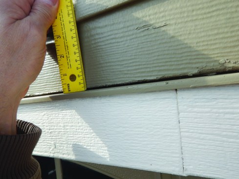 The gap above header flashing &nbsp;should remain uncaulked, but should be at least 1/4-inch. This gap is much too small.