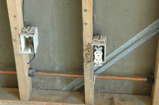 The electrical devices were pulled loose from their boxes so any debris or water in the boxes could be cleaned out and dried. It will be up to the restoration or remodeling contractor to replace the compromised devices.