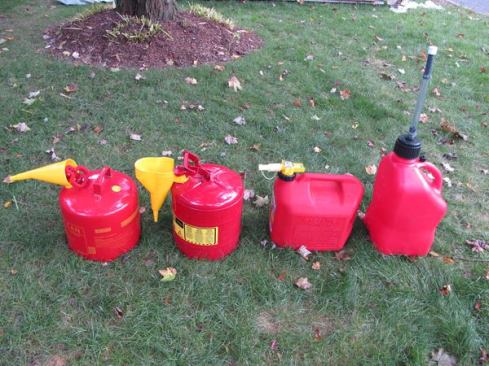 The metal cans on the left (Eagle and Just-Rite) make use of removable plastic funnels, the No-Spill has a stubby plastic spout, and the VP Racing has what looks to be a homemade spout.