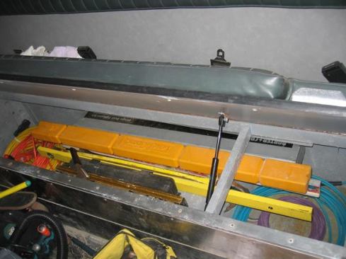 The bench on the right side of the module is built like a window seat--with a hinged top that can be opened to access storage below. The author keeps hoses, cords, and long items such as levels and crow bars in this space.