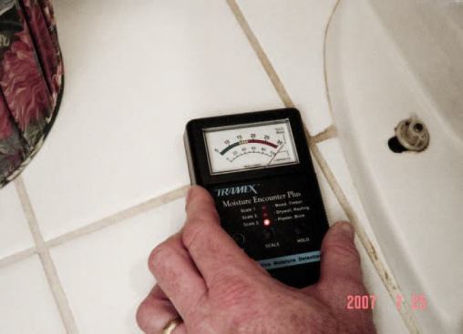 A moisture meter confirmed that the floor around the toilet was soaked.