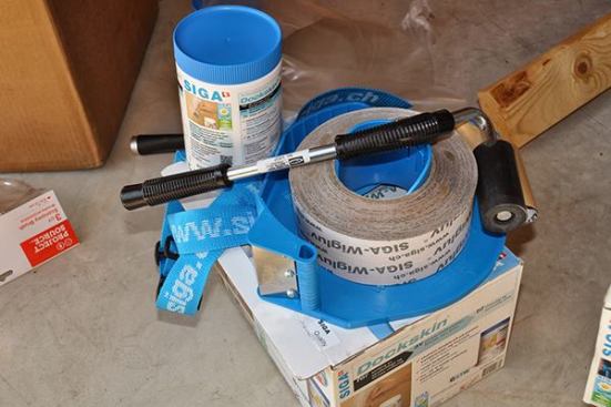 Siga Wigluv 60 (2.25") tape, Dockskin primer, Siga tape dispenser, and J-Roller to ensure a tight install.