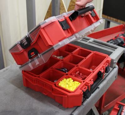 Milwaukee Jobsite Organizer. These modular boxes were announced a couple of months back but this was the first time I saw them in person. I already knew they 
were well-designed—with more storage space than the 
DeWalt boxes I currently own and a top-mounted clip that allows lids to be opened without removing the box above. 
Click here for video.