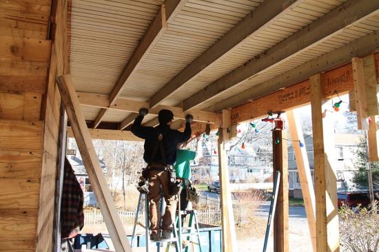 Project manager Mark Pollard reframes the porch structure in November. Pollard says that the work on the porch had a significant effect on the effort to jack up and reinforce the roof. Evidently, settling of the porch structure was pulling down the roof hips above the porch. Only after the porch was removed and a new carrying beam was installed across the front of the house and jacked into level was the crew able to jack up the home’s ridge beam and pull its balloon-framed kneewalls into realignment.