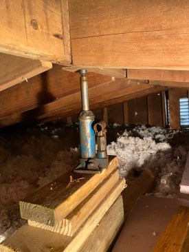 Remediation began with jacking the ridge board back in place.