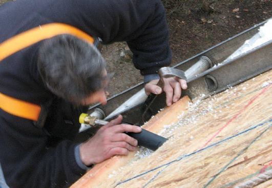 Snaking the pipes through the panels to the basement proved to be tricky.