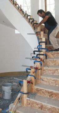 It takes a lot of clamps and sometimes a little bit of force to bend and twist the rail into position.