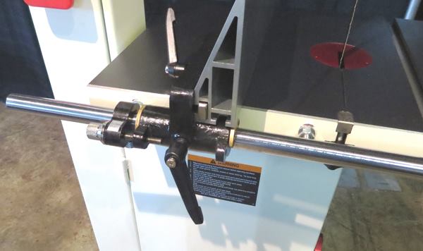 The band saw includes a heavy steel fence with a fine adjustment mechanism. The fence can be flipped and used on-edge for resawing (as shown) or on the flat when ripping thin material.
