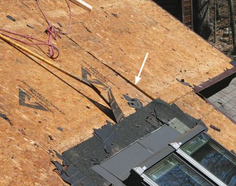 Arrow indicates displacement in the roof panel edge.