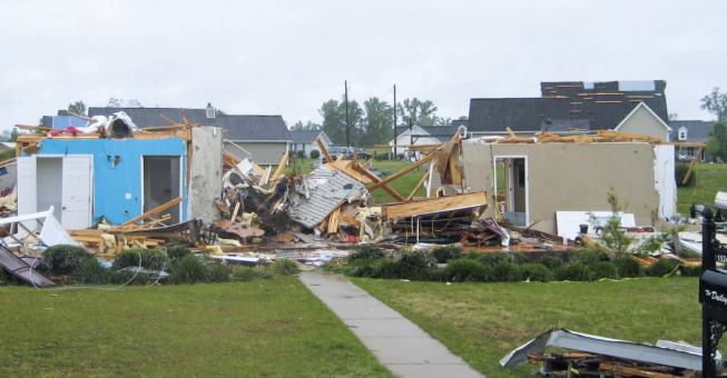 A nearby home lost all its exterior walls.