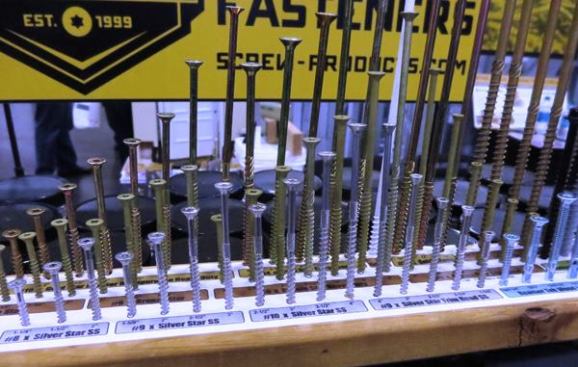 A Screw Display. I took this photo at the 
Screw Products Inc. booth because I like keeping an assortment of fasteners on hand and these guys seem to have many to choose from. Their booth was close to where deck building demos were being performed and I’m guessing they were there to connect with deck builders. But their product line spans multiple trades so there was something there for everyone. I saw zinc coated steel, stainless steel, bronze, and exterior coated fasteners. Most were self-drilling, many were self-reaming, and nearly all had star-drive heads. I can’t tell you anything about the quality or price of these screws. I just like fasteners—so here they are.