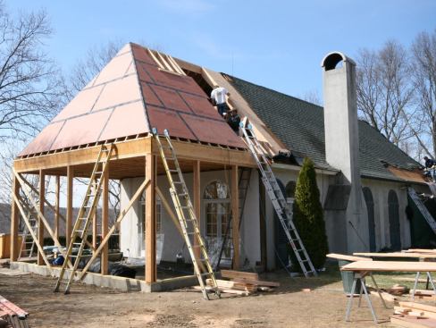We sheathed the new roof with Zip System panels taped at the seams, which we like because they dry in quickly and are easy to walk on.