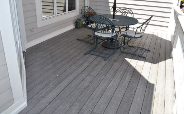 The original decking and railing were reinstalled to complete the roofing job.