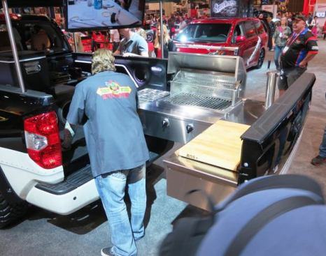 Celebrity Chef Tim Love and his build team turned this 2014 Toyota Tundra into a mobile barbeque and entertainment center. Like so many SEMA show vehicles this one is over the top and features: a 27” 24,000 BTU grill, cold storage coolers, three TVs, a play station, a Rockford Fosgate audio system (with more speakers than you can count), and of course—a pair of taps for beer or wine.