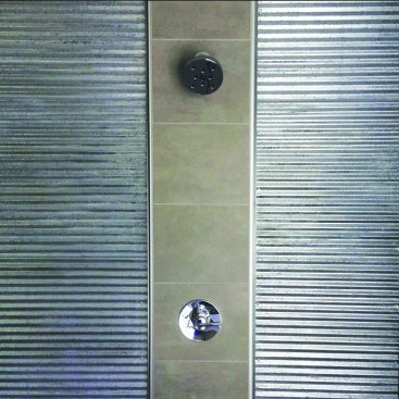 The central column stands proud of the metal panels. Once tiled, it provided a flat surface for the showerhead and mixer trims.