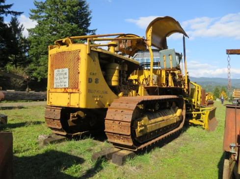This 1951 Caterpillar D8 was converted to a yarder. A stayed tower (spar) would have extended up from the machine and been connected by cable to a tree or stump some distance away. Felled logs would have been connected to a carriage on the cable and then winched up to the yarder and loaded onto a truck for transport.