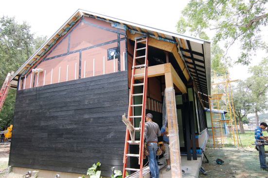 Rainscreen Wood Siding. Notice the vented roof too.