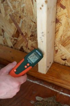 Dry your structure down to less than 20%, or ideally less than 17%, moisture content before moving on with rebuilding. I'm using my ExTech Moisture Meter.