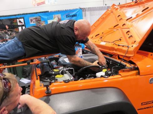 The “bed” on the Elevator is referred to as the “flying platform”—which is a good description because when the mechanic is on it he’s in the Superman flying position. If you’ve ever had to work on a part of the engine back near the firewall then you’ll understand how cool this product is. It’s adjustable for height, can support 350 pounds, and easily tilts back to the vertical position.