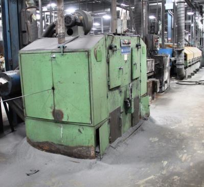 Before wire is drawn it is run through one or more descalers, which use a series spinning wire brushes to remove slag, rust, and other debris. 
Click here for video.