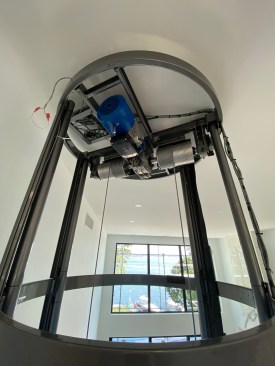 The cab is driven by a motorized hoist, located at the top of the shaftway, with all the wiring coming from the attic above.