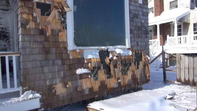 Crashing waves damaged the cedar shingle siding on Hackett’s house during the storm in the pre-dawn hours. The shingles have been pushed up and snapped, but Grace Ice and Water Shield used as underlayment appears to have protected the wall framing and sheathing.